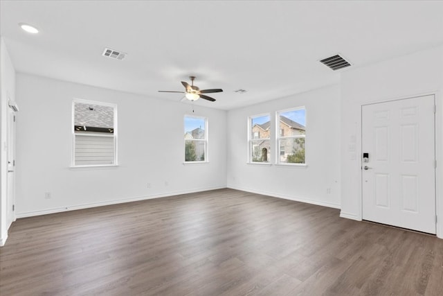 interior space with dark hardwood / wood-style flooring and ceiling fan