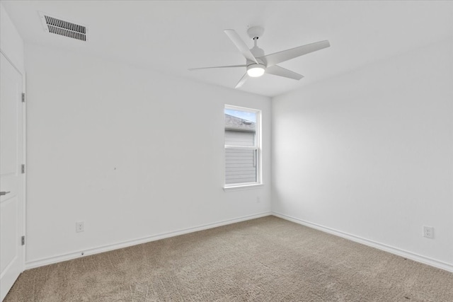 spare room with carpet flooring and ceiling fan