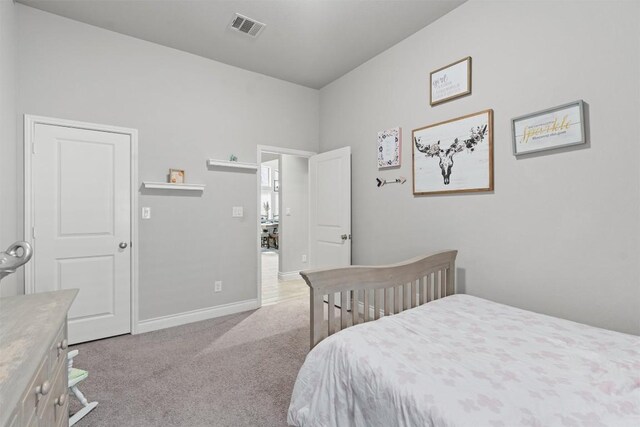 bedroom with light carpet