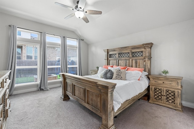 bedroom featuring light colored carpet, ceiling fan, and lofted ceiling