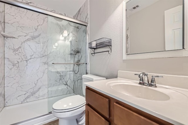 bathroom with vanity, toilet, and walk in shower