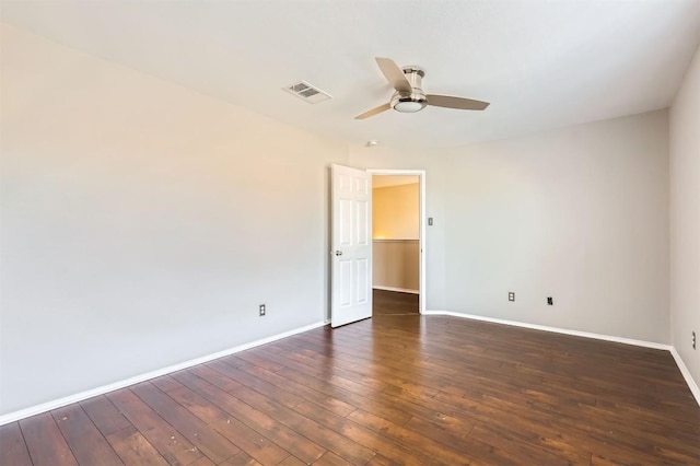 unfurnished room featuring ceiling fan and dark hardwood / wood-style floors