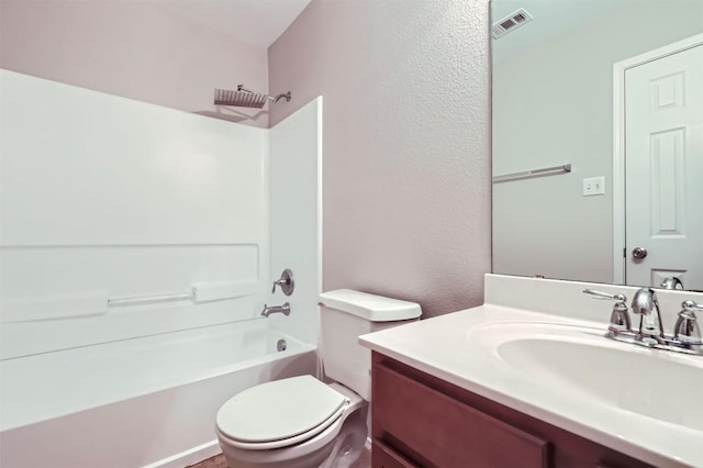 full bathroom featuring vanity, bathing tub / shower combination, and toilet