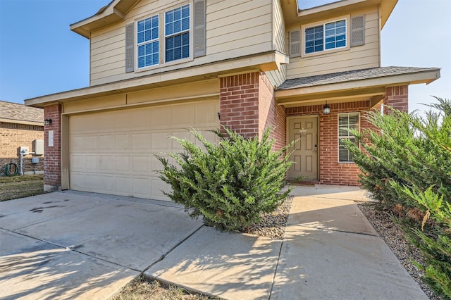 view of front of property with a garage