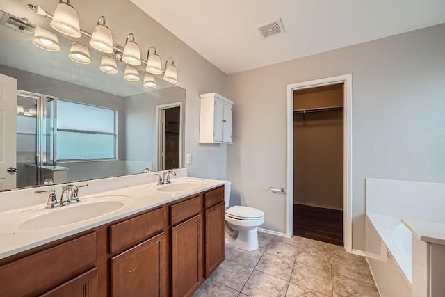 full bathroom with toilet, vanity, tile patterned floors, and independent shower and bath