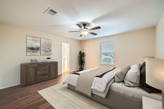 bedroom with ceiling fan and wood-type flooring