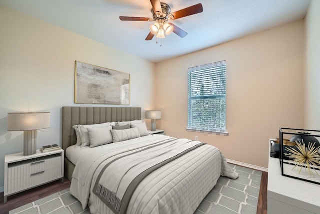 bedroom featuring ceiling fan and wood-type flooring