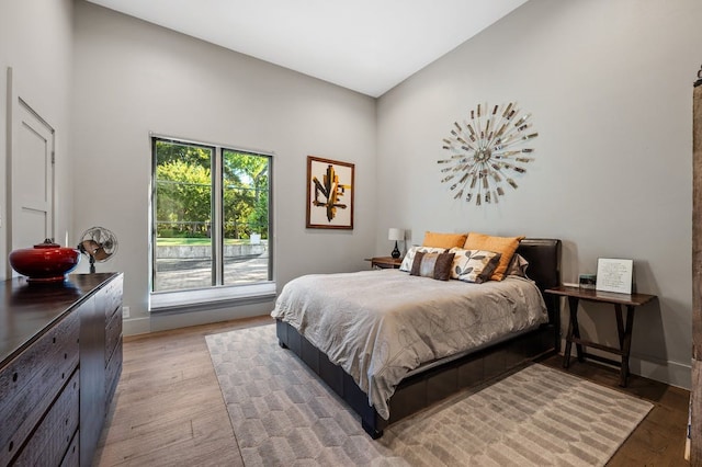 bedroom with hardwood / wood-style floors