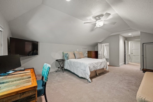 carpeted bedroom with ceiling fan, lofted ceiling, and a textured ceiling