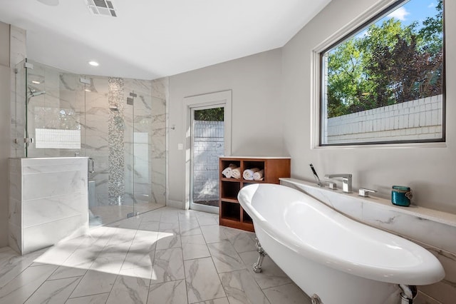 bathroom featuring sink and shower with separate bathtub