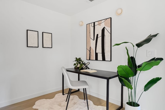 home office with light wood-type flooring