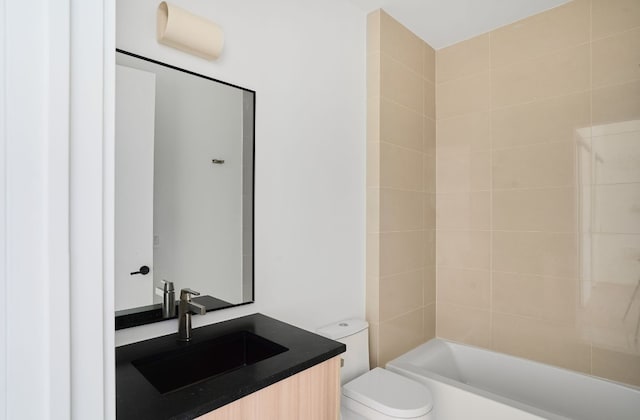 full bathroom featuring vanity, toilet, and tiled shower / bath combo