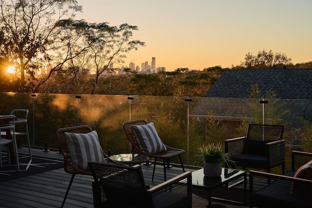 deck at dusk featuring an outdoor living space