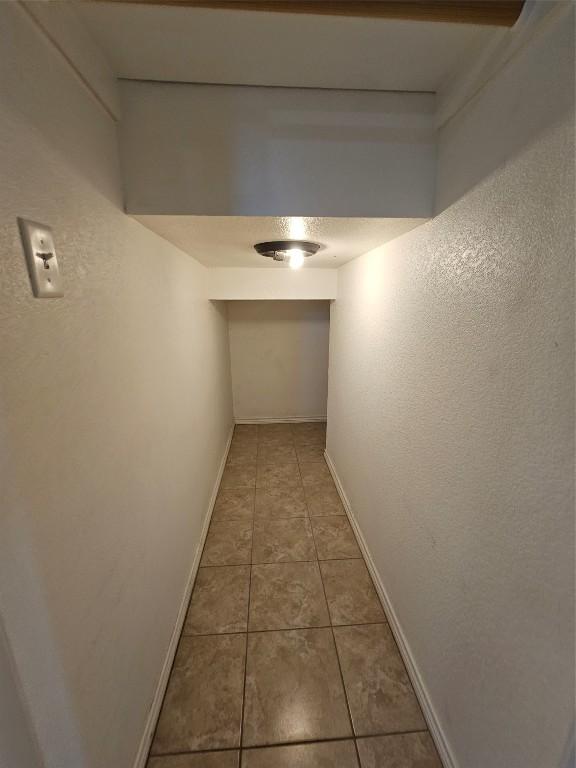 corridor featuring tile patterned floors