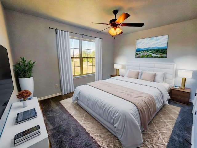 bedroom with ceiling fan and carpet floors