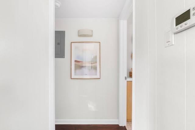 hallway with ornamental molding and electric panel