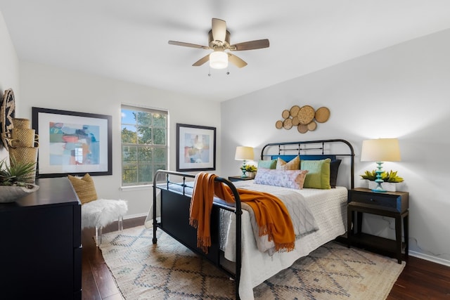 bedroom featuring ceiling fan and dark hardwood / wood-style flooring