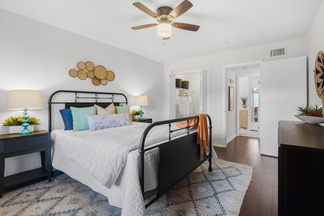 bedroom featuring ceiling fan and dark hardwood / wood-style flooring