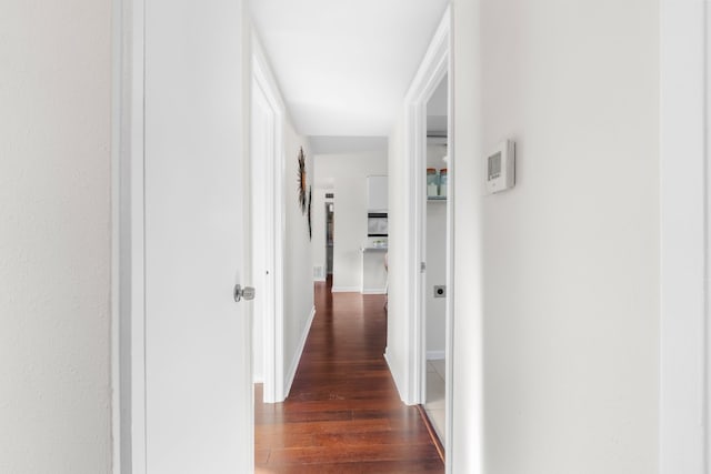 hallway featuring dark hardwood / wood-style floors