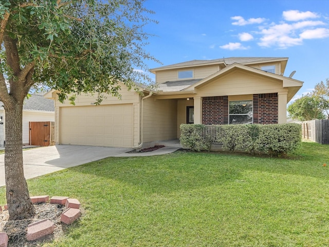 view of front of property with a front lawn and a garage