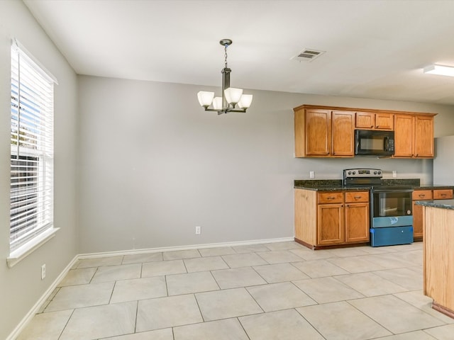 kitchen with an inviting chandelier, light tile patterned floors, pendant lighting, and stainless steel electric range