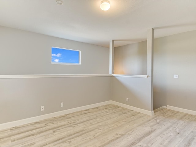 basement featuring light hardwood / wood-style floors