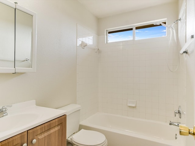 full bathroom featuring washtub / shower combination, toilet, and vanity