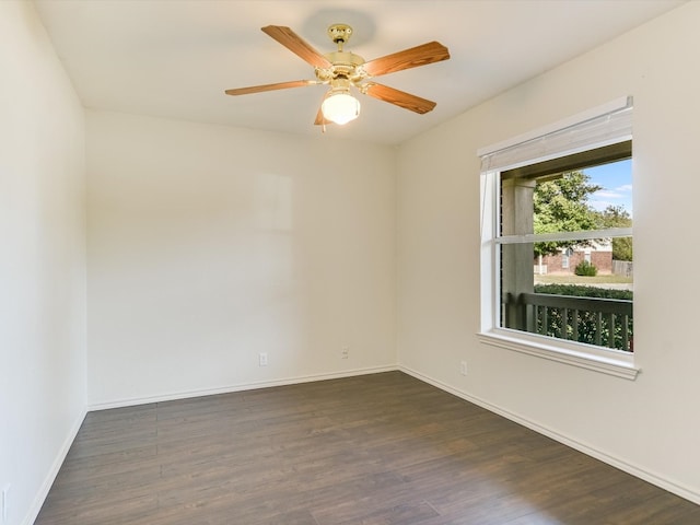 spare room featuring ceiling fan and dark hardwood / wood-style flooring