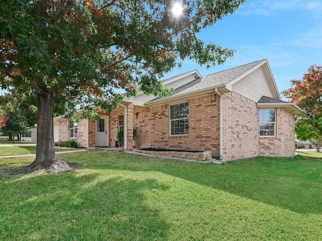 ranch-style house with a front yard