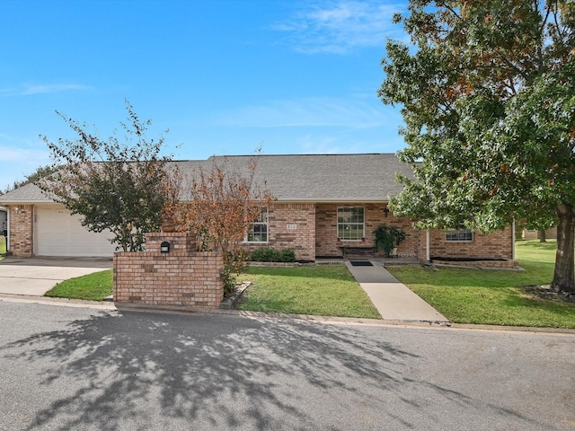 view of front facade with a front lawn and a garage