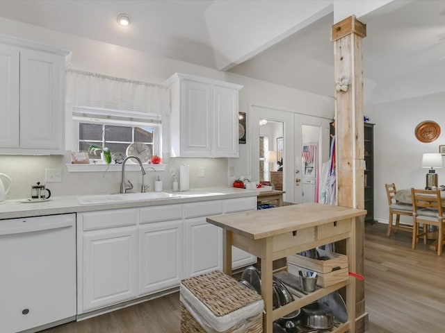 kitchen featuring dishwasher, white cabinetry, french doors, sink, and dark hardwood / wood-style floors