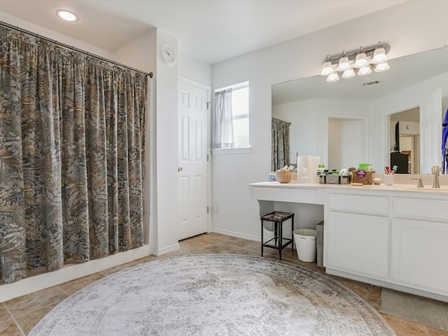 bathroom featuring vanity and a shower with curtain