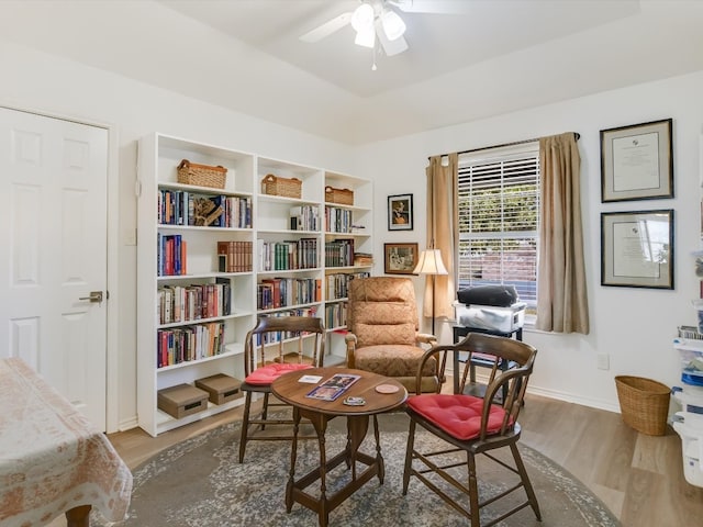 living area with light hardwood / wood-style flooring and ceiling fan