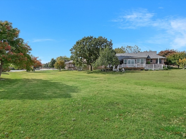 view of yard with a deck