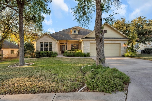 single story home featuring a front lawn and a garage