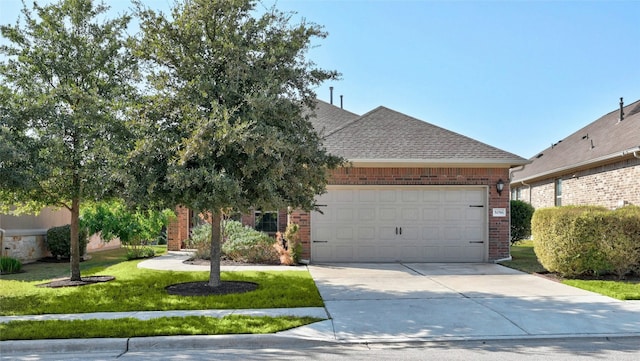 view of front of house featuring a garage and a front yard