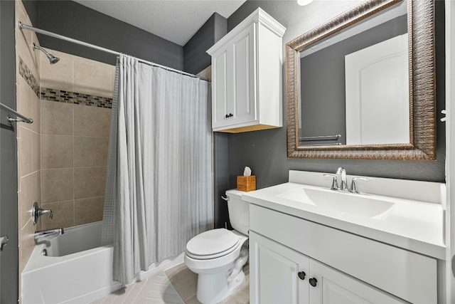 full bathroom featuring shower / bath combo, vanity, a textured ceiling, tile patterned flooring, and toilet