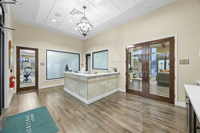 interior space featuring an inviting chandelier and french doors