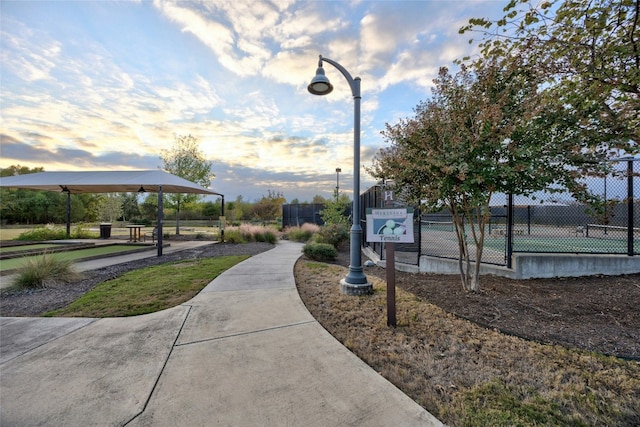 view of community with tennis court