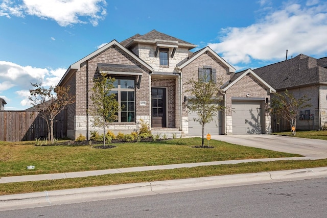 view of front facade featuring a garage and a front lawn