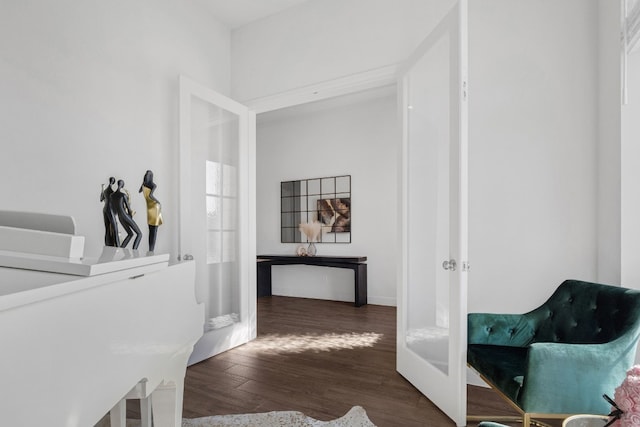 corridor with dark wood-type flooring and french doors