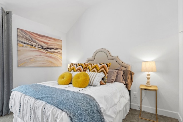 bedroom featuring carpet floors and vaulted ceiling