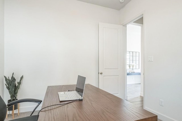 office area featuring baseboards