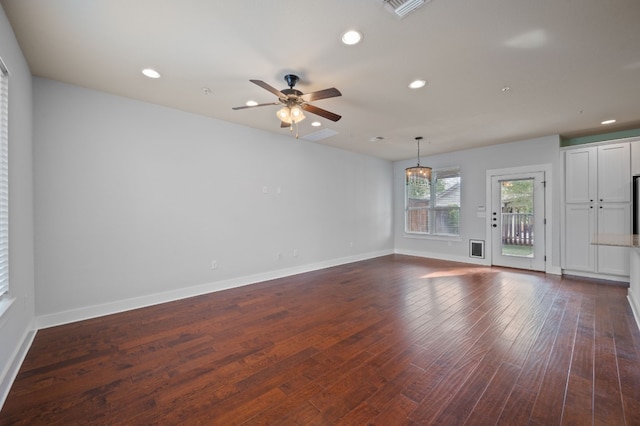 spare room with ceiling fan and dark hardwood / wood-style flooring