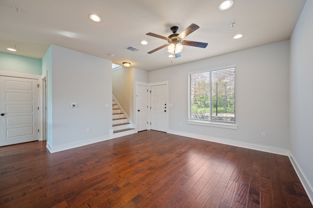 spare room with ceiling fan and dark hardwood / wood-style flooring