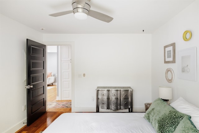 bedroom featuring ceiling fan and dark wood-type flooring