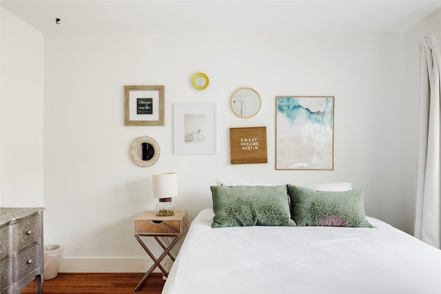 bedroom with hardwood / wood-style flooring