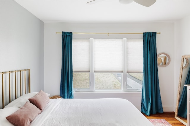 bedroom featuring ceiling fan and light hardwood / wood-style floors