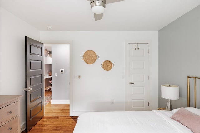 bedroom with ceiling fan and light hardwood / wood-style floors