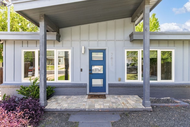 7611 Providence Ave Unit A, Austin, TX 78752 - doorway to property featuring board and batten siding
